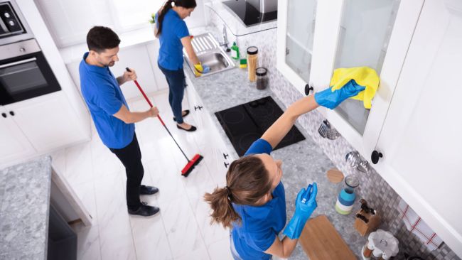 team cleaning apartment home